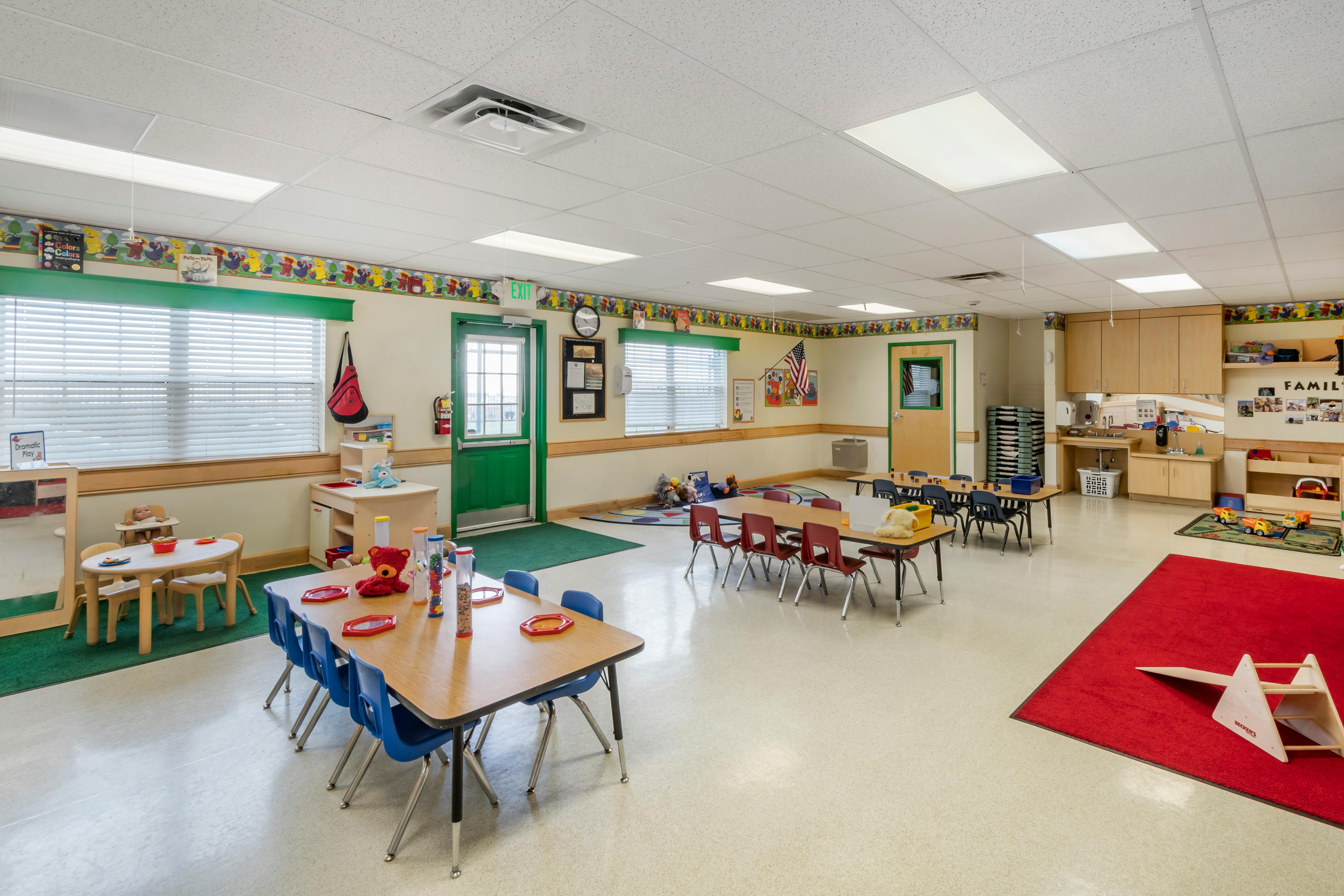 Classroom with multiple activity tables and chairs for children
