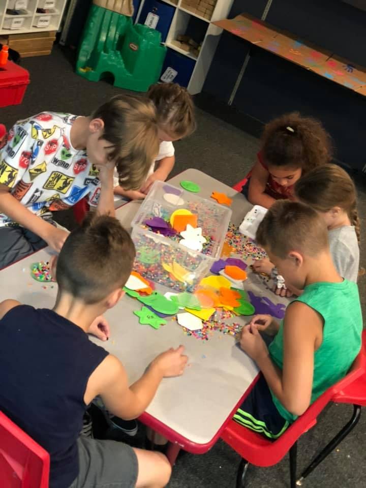 Children doing crafts at a table