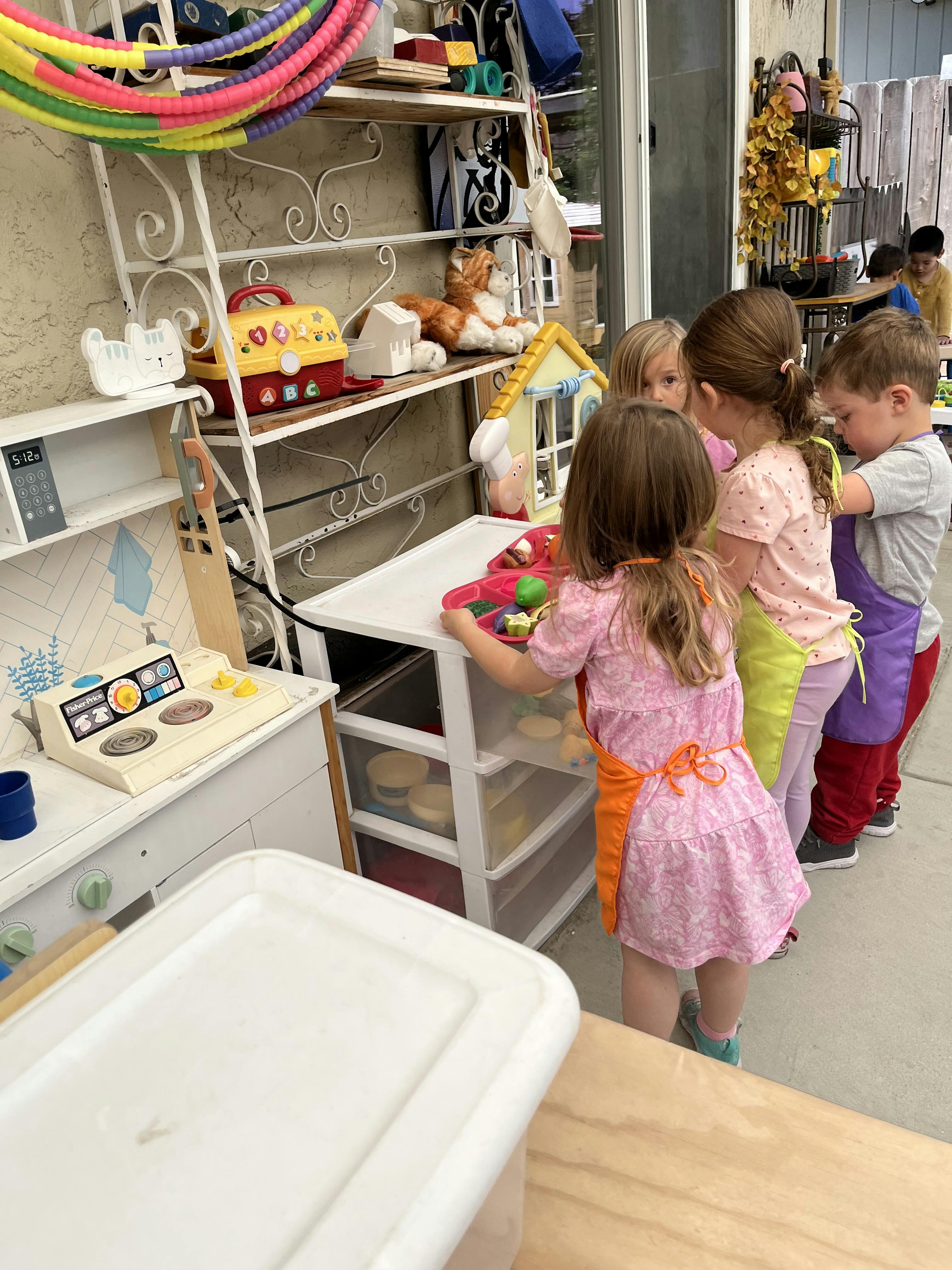 Children playing with toys in a classroom