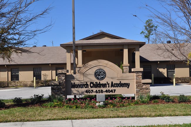 Monarch Children's Academy sign in front of a building