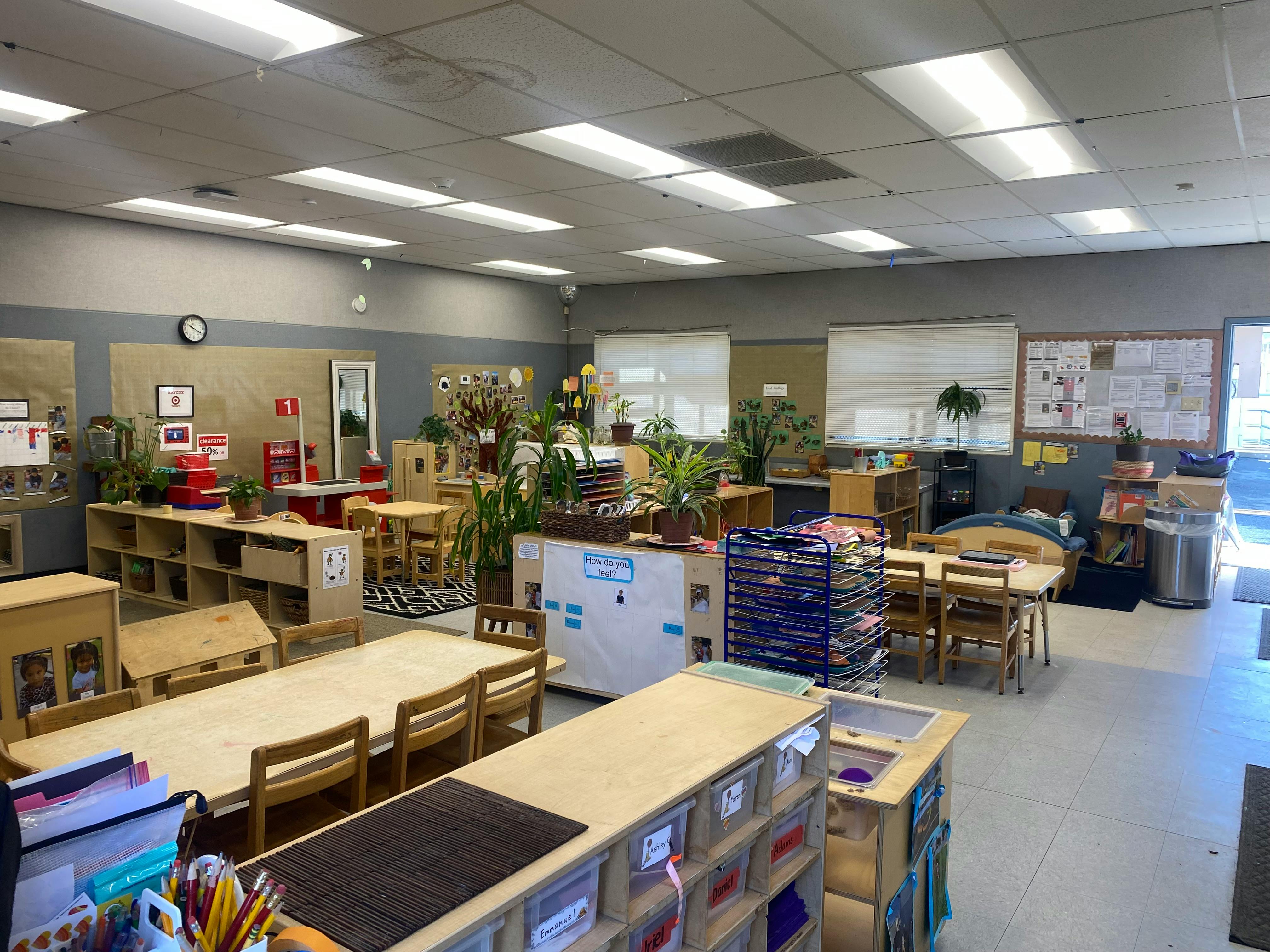 Classroom with tables, chairs, and storage units