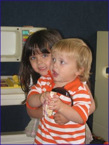 Two children in striped shirts
