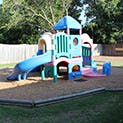 Playground structure with slides and climbing areas