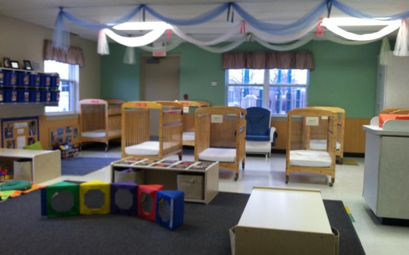 cribs in a daycare room