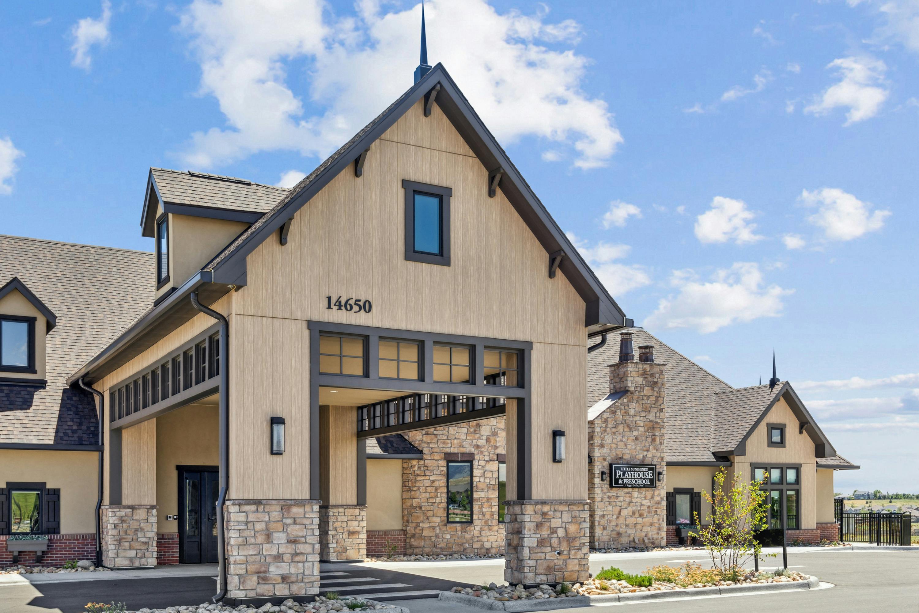 Building with a covered entrance and stone accents
