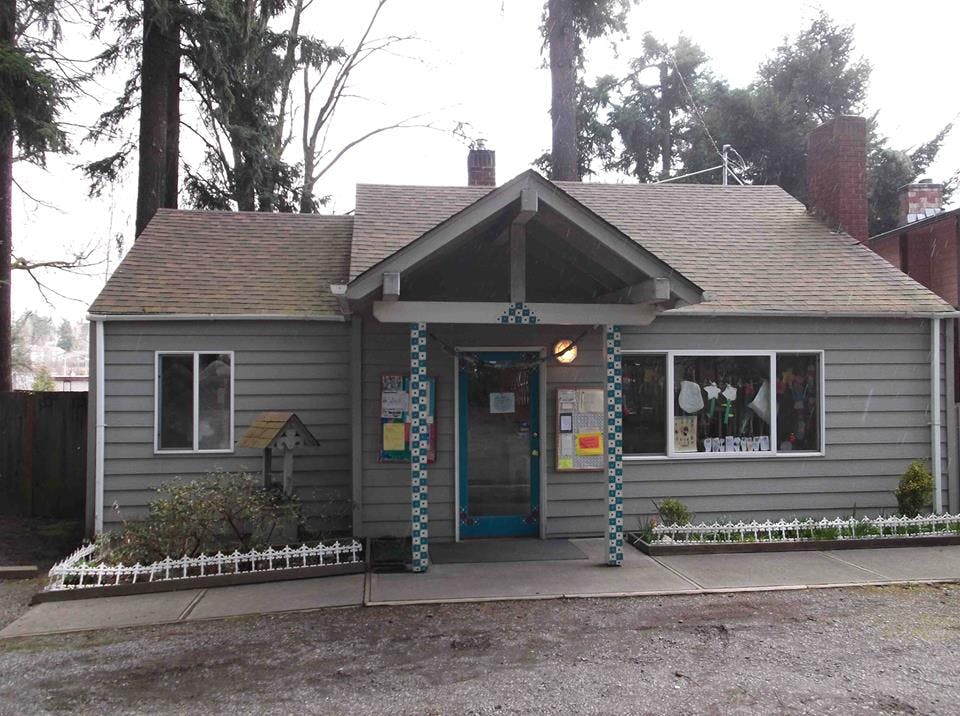 Small house with a covered porch and a blue door