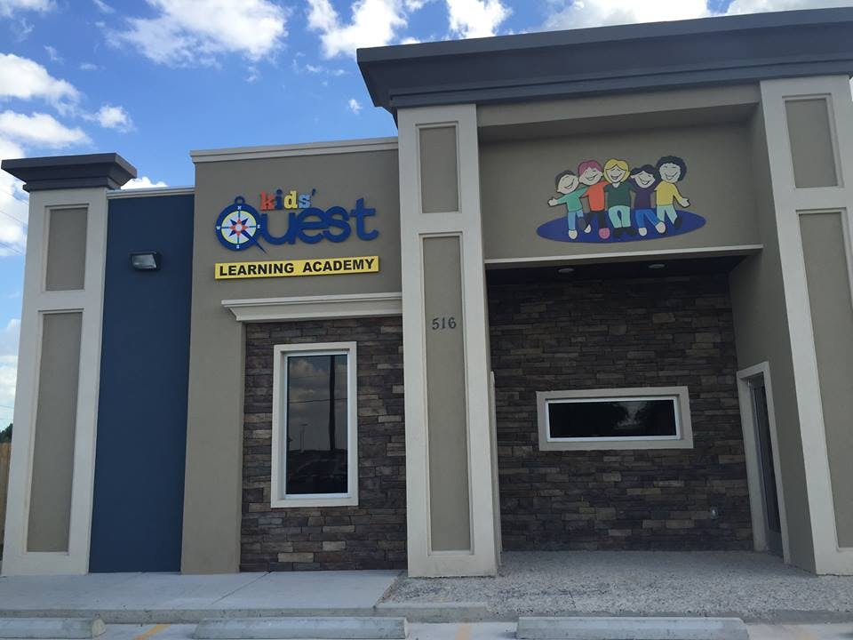 Kidz Quest Learning Academy building exterior with cartoon children