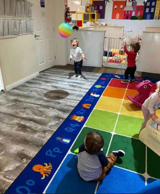 Children playing with balls in a playroom