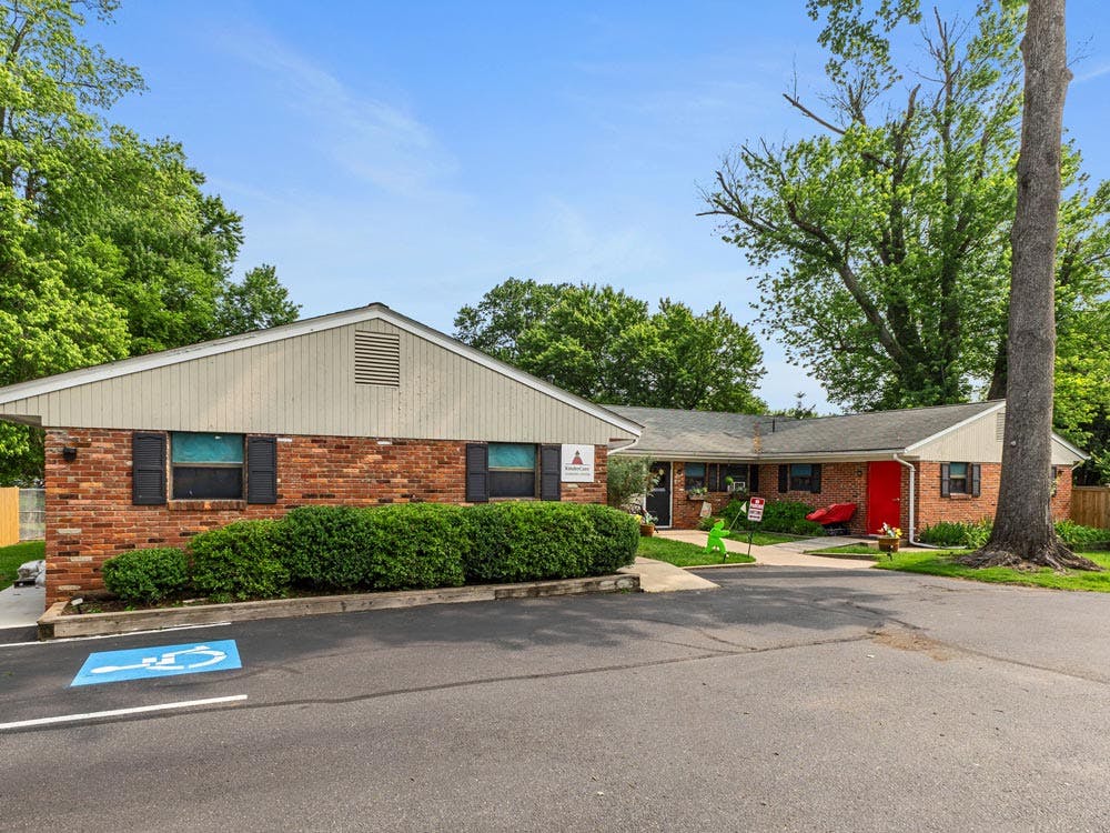 Brick building with a parking lot and a handicapped parking space