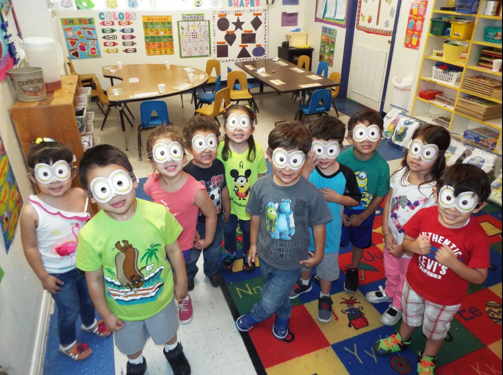 Children with painted faces in a classroom