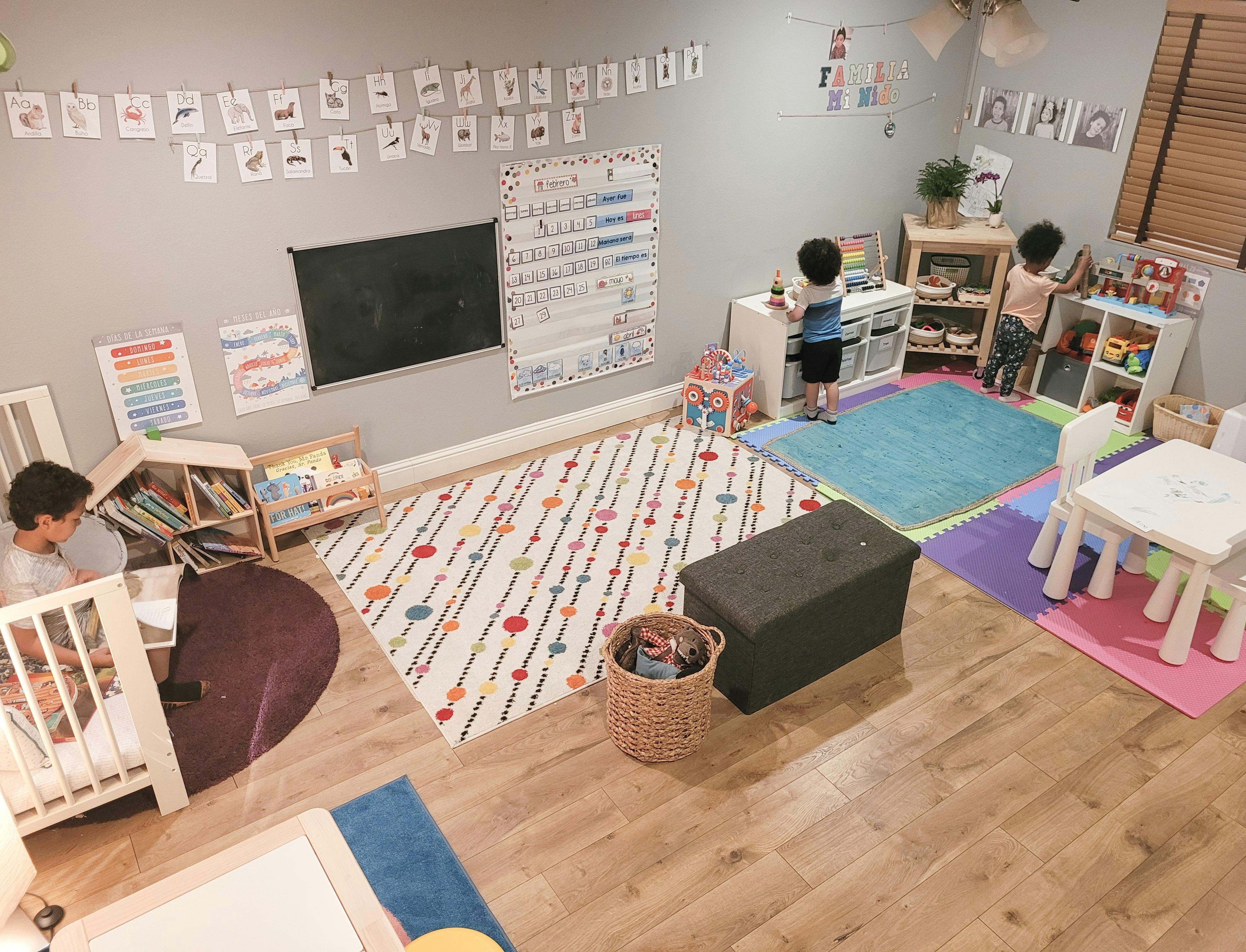 Three children playing in a classroom