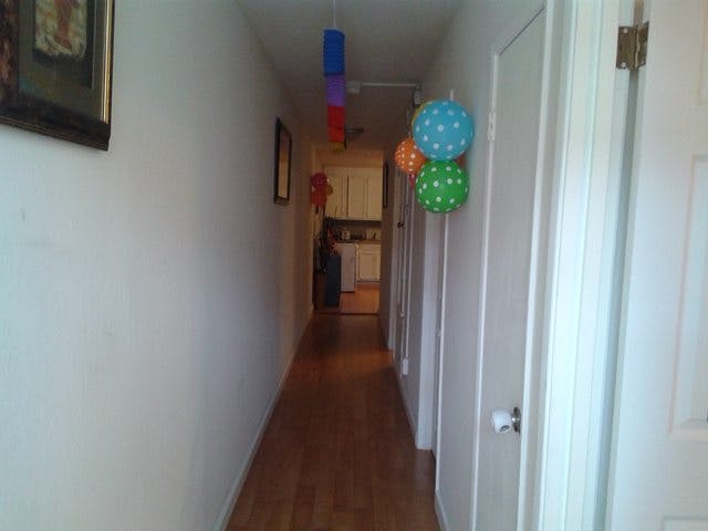 Hallway with hanging decorations and doors