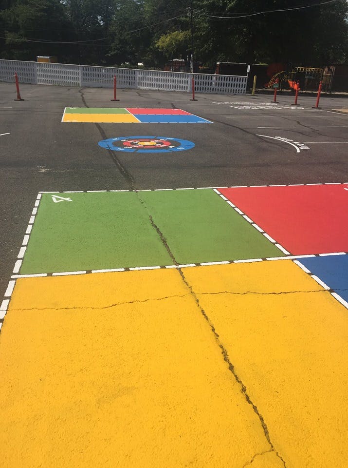 Colorful painted squares on an asphalt playground