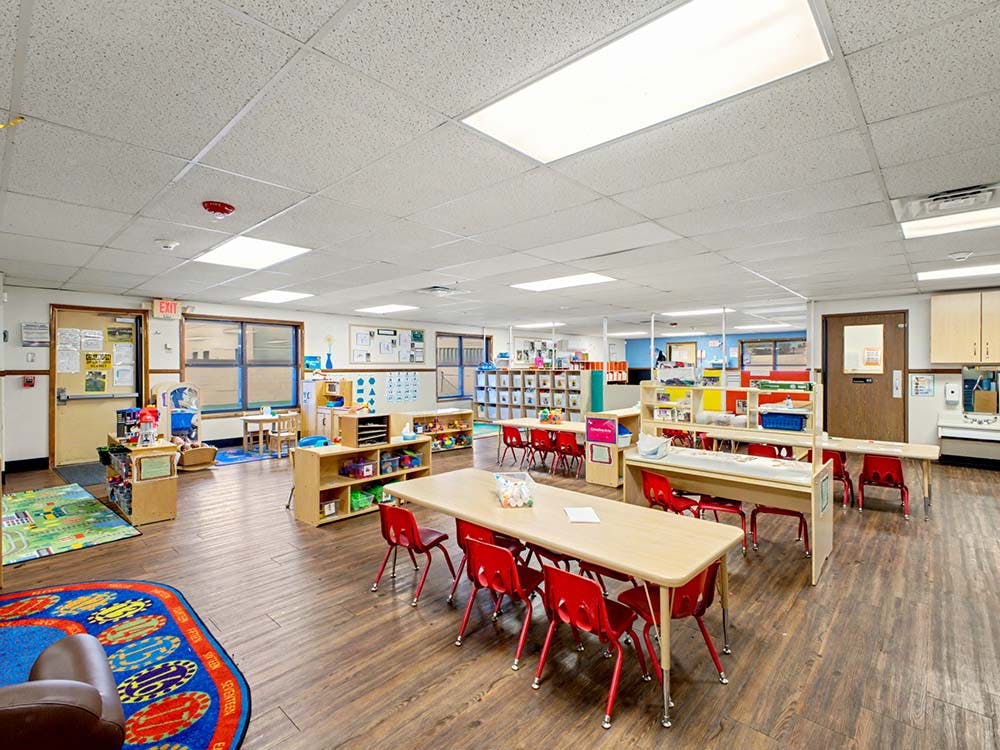 Classroom with child-sized tables and chairs
