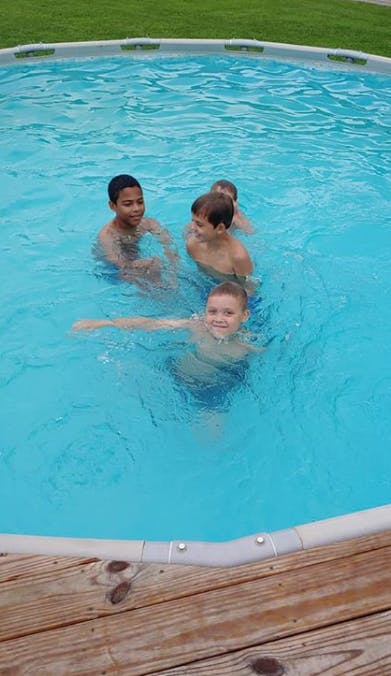 Three children in a swimming pool
