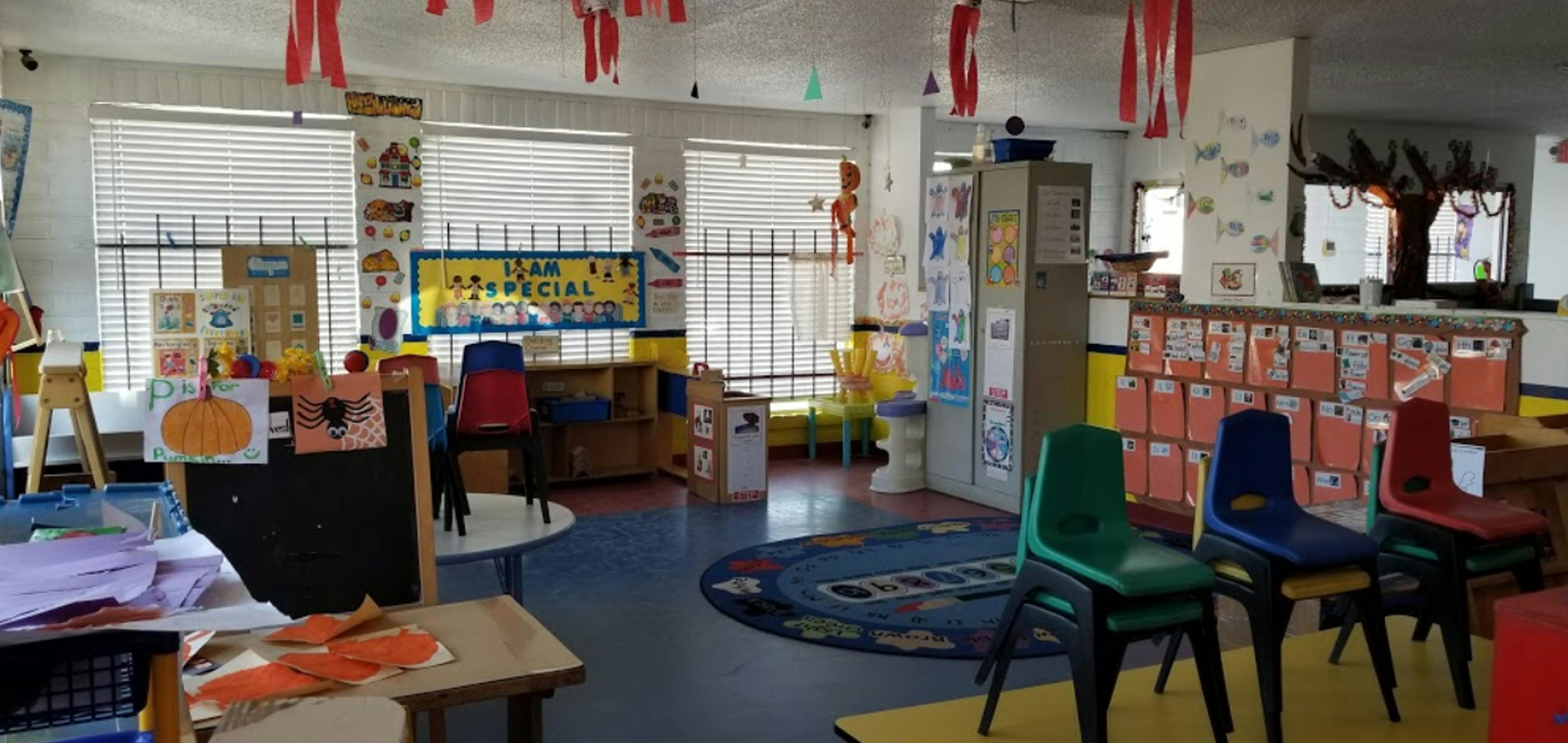 Colorful classroom with small chairs, tables, and decorations