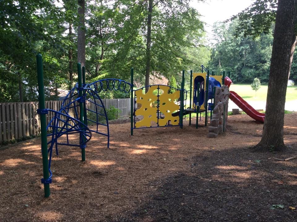 Playground with climbing structures and a slide