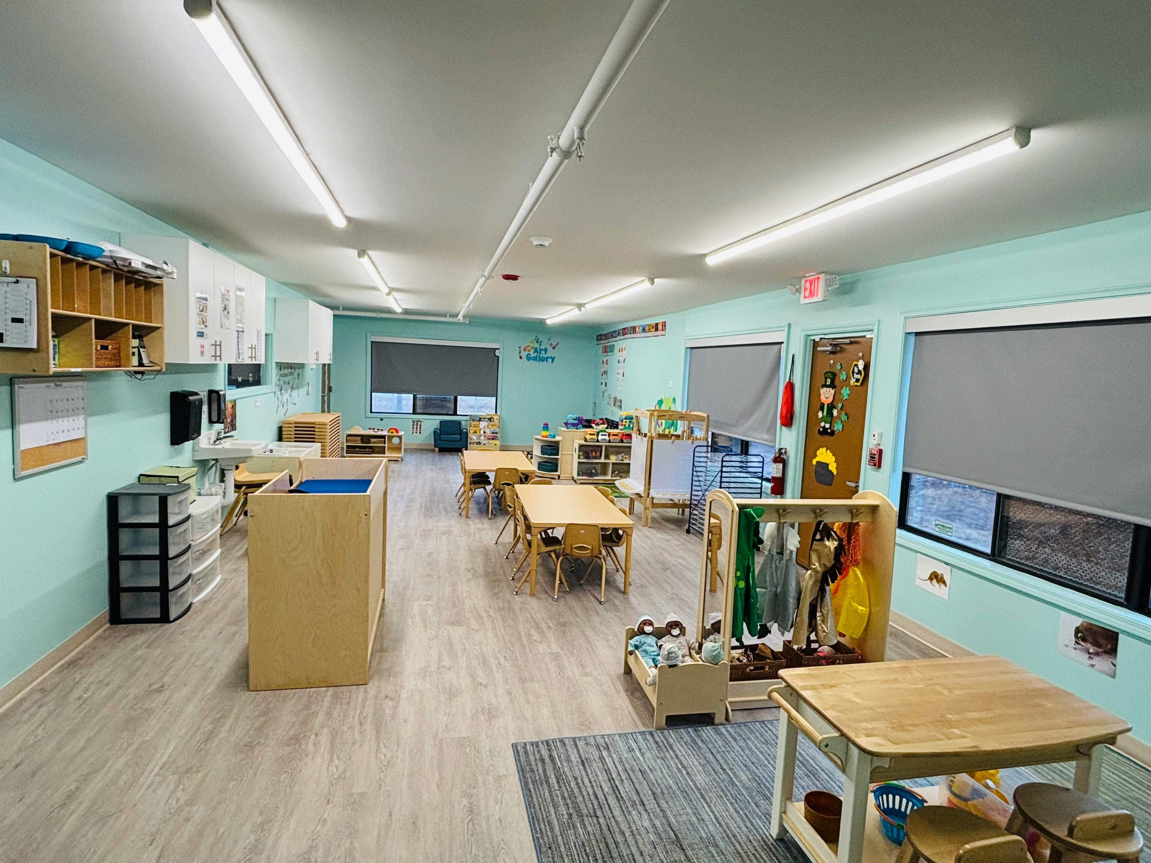 Empty classroom with small tables and chairs