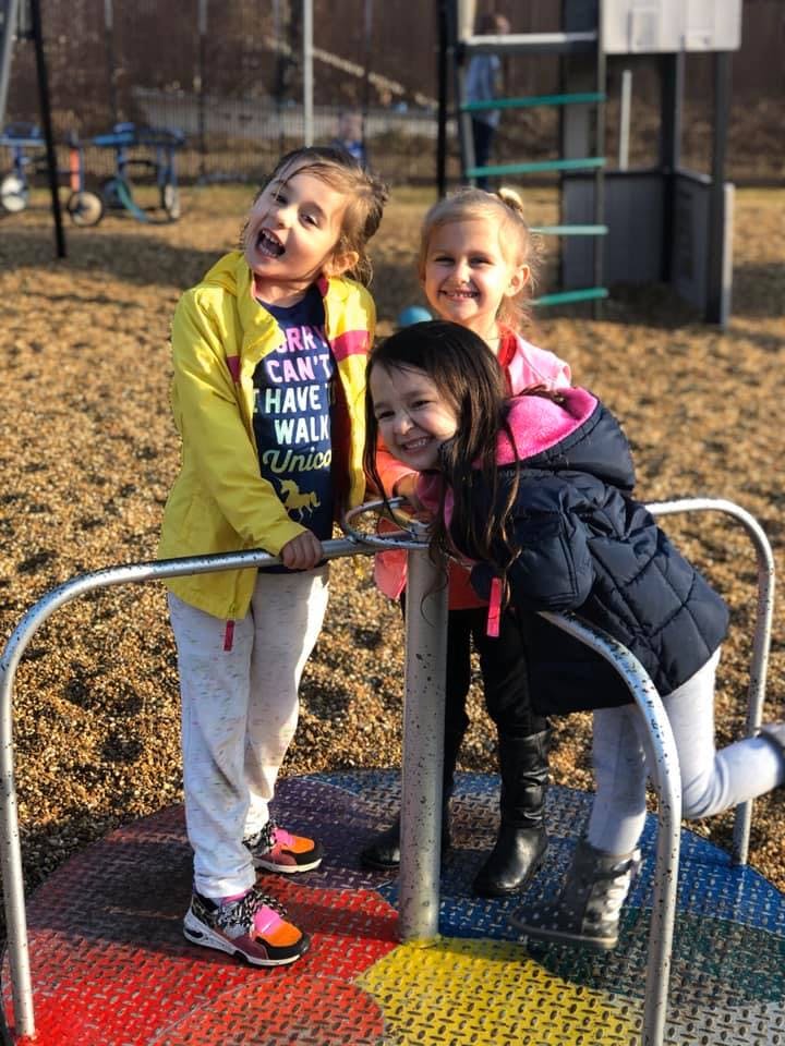 Three children on a merry-go-round