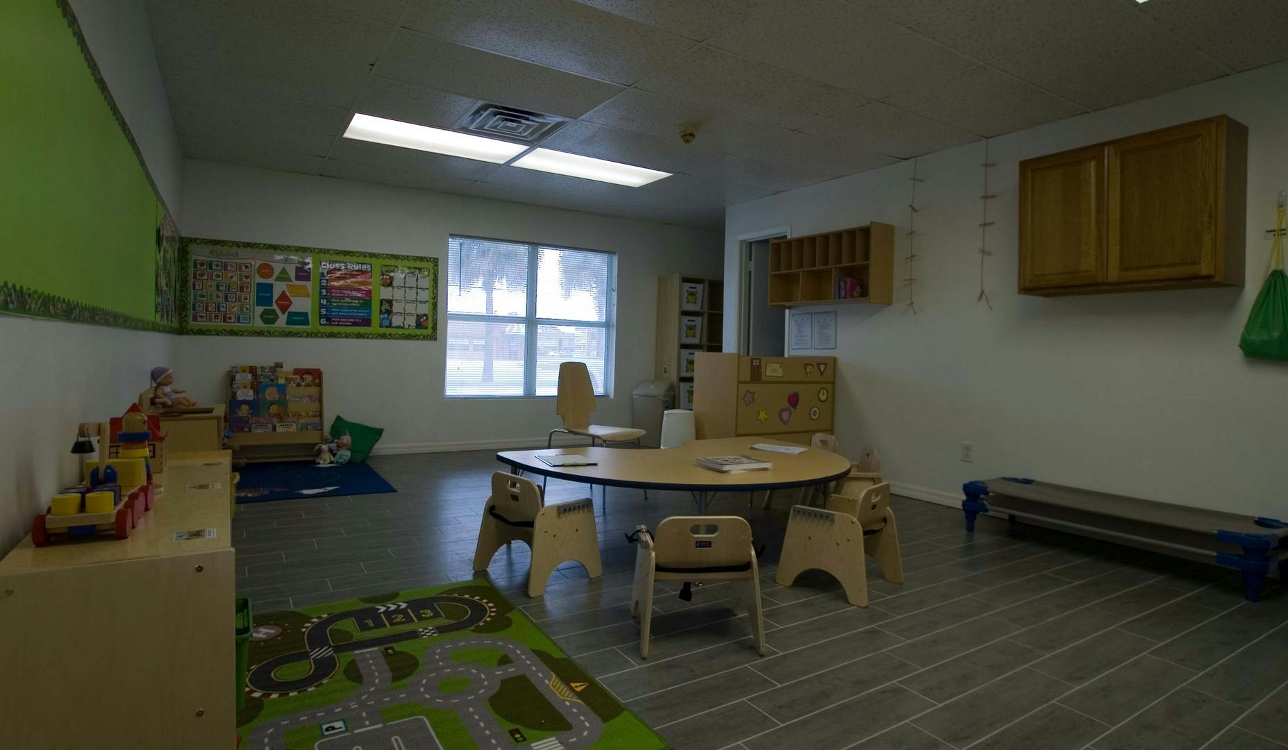Empty classroom with small tables and chairs