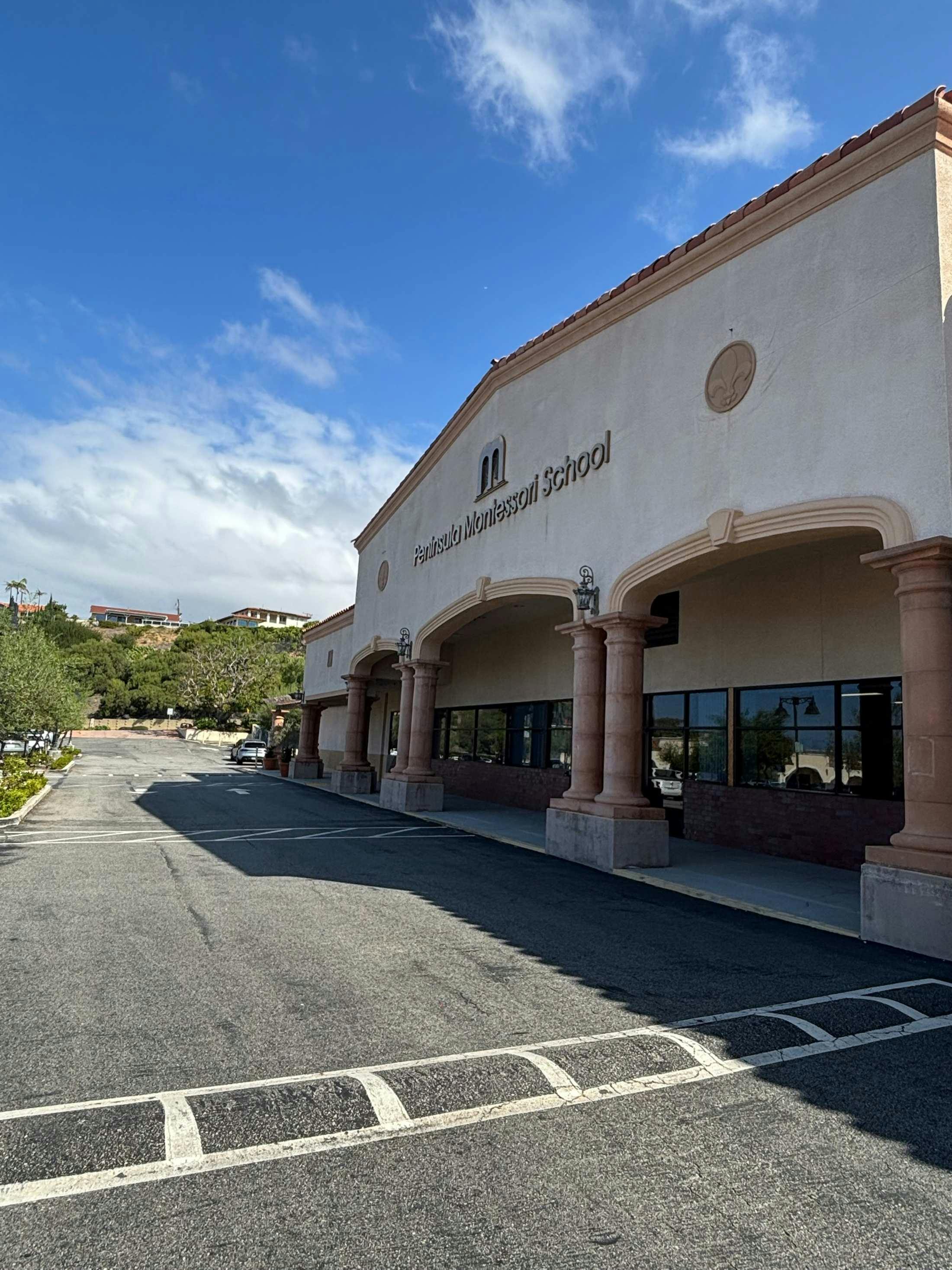 Exterior of Peninsula Montessori School building and parking lot