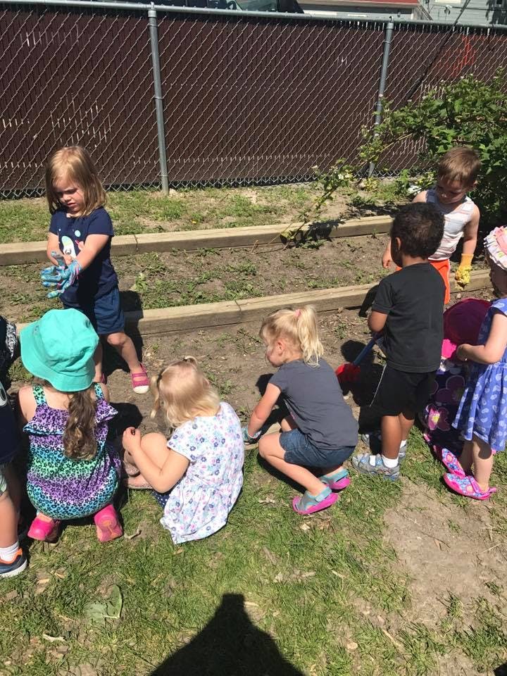 Children playing in a garden