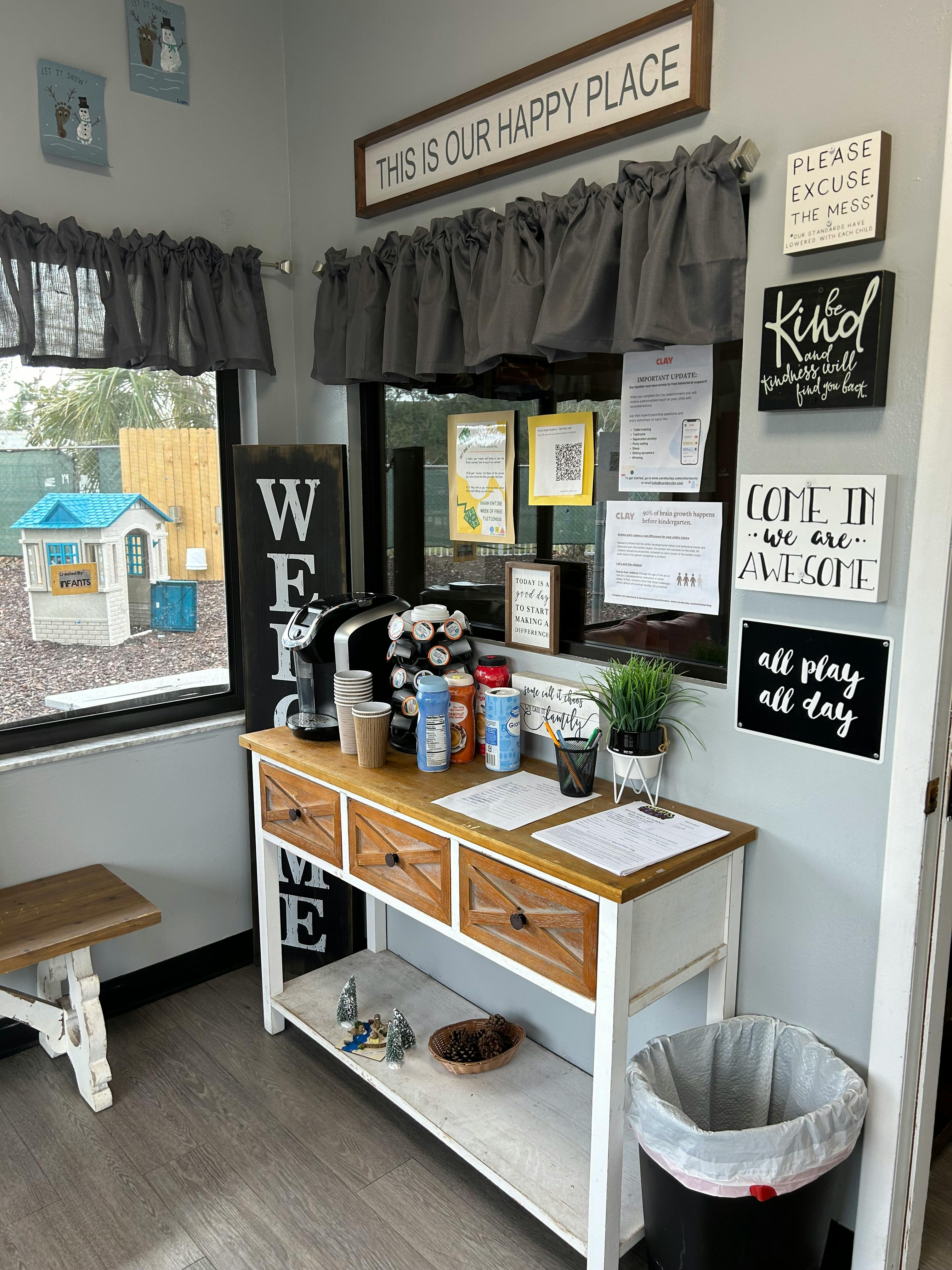Coffee station with a sign that says "This is our happy place"