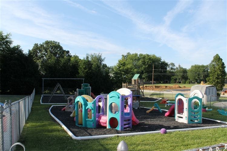 Outdoor playground with colorful play structures and slides