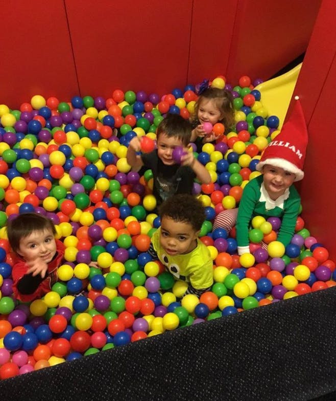 Children playing in a ball pit