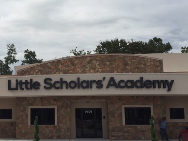 Building with "Little Scholars' Academy" sign