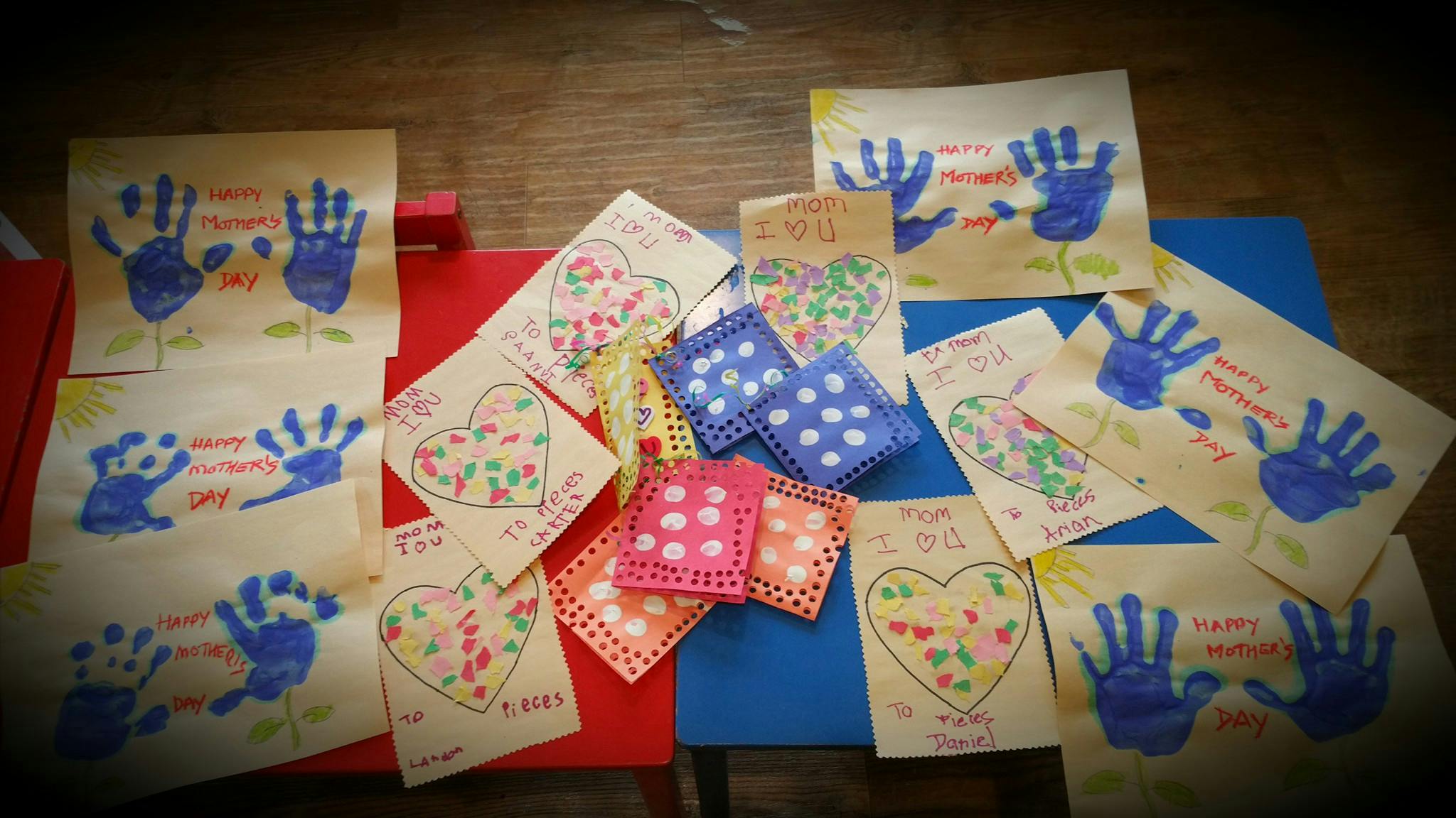 Handprint art and heart drawings on paper