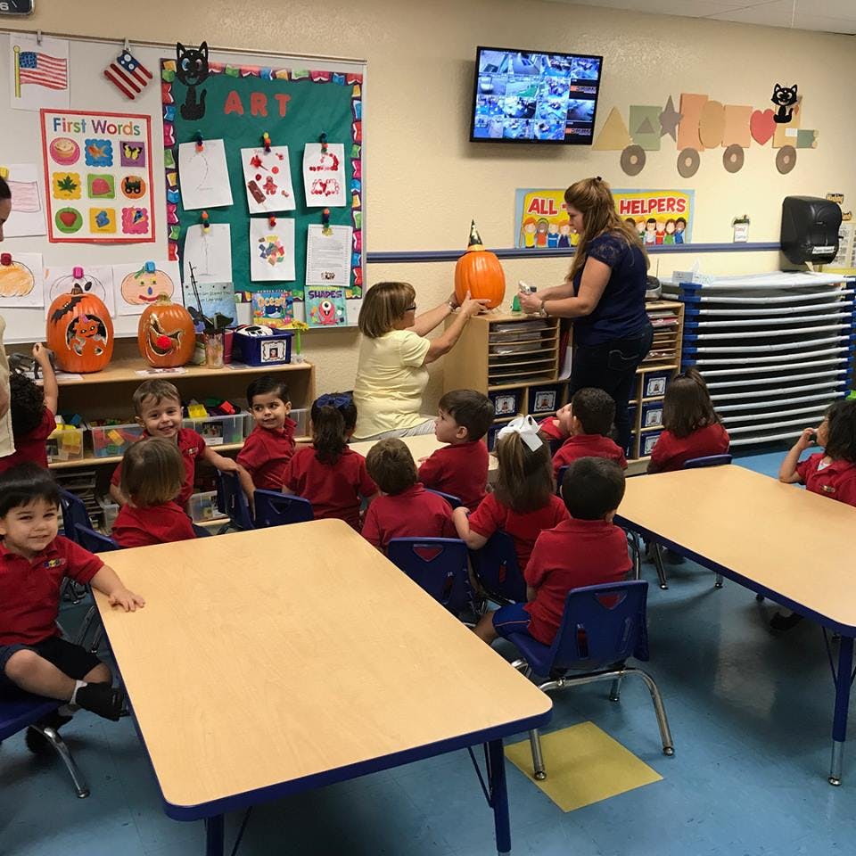 Adult and children in a classroom