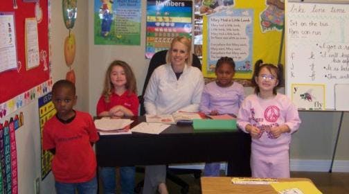 Adult and children in a classroom