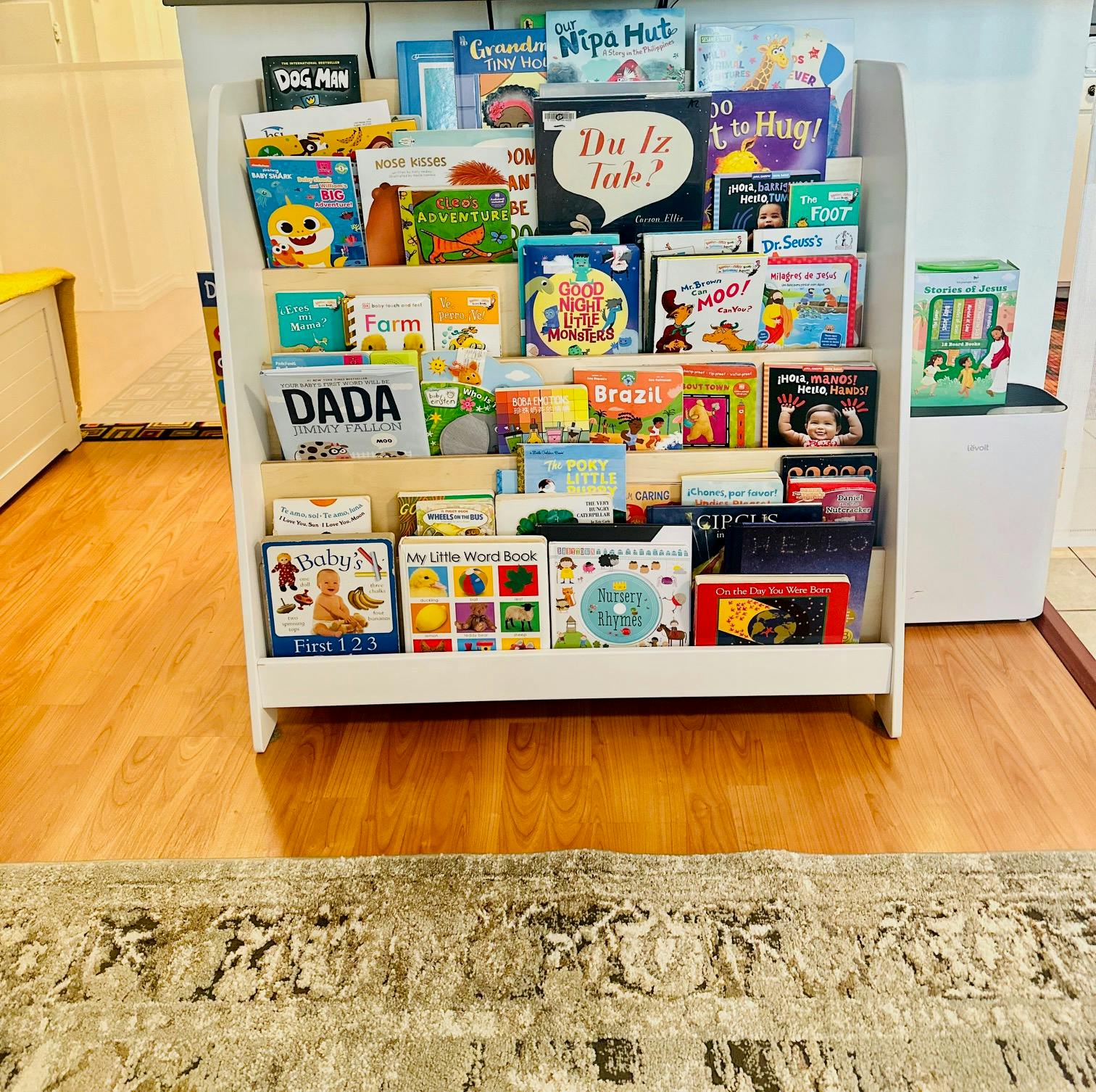 White bookshelf filled with children's books