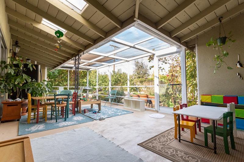 Sunroom with tables and chairs