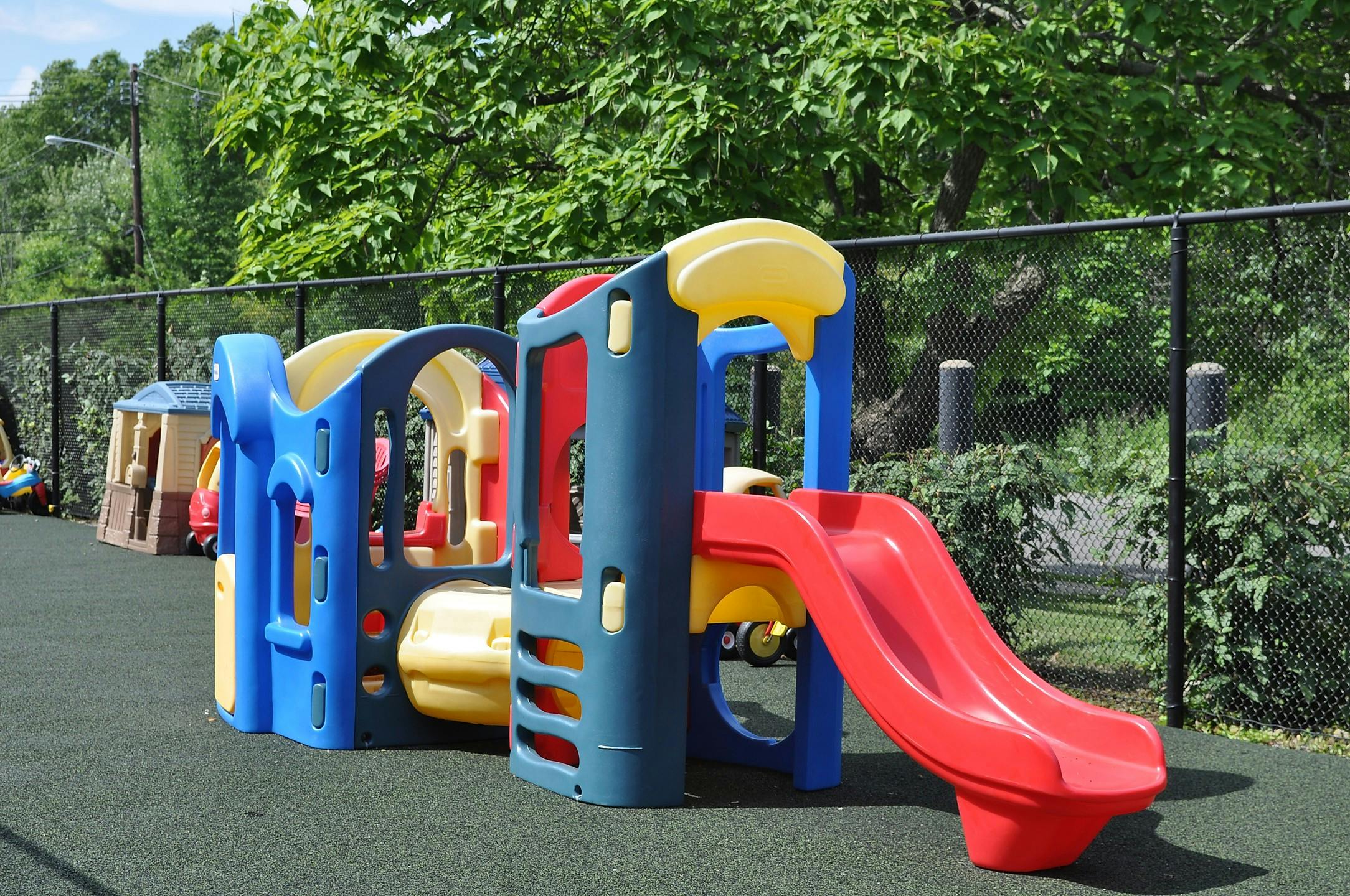 Colorful playground structure with a red slide