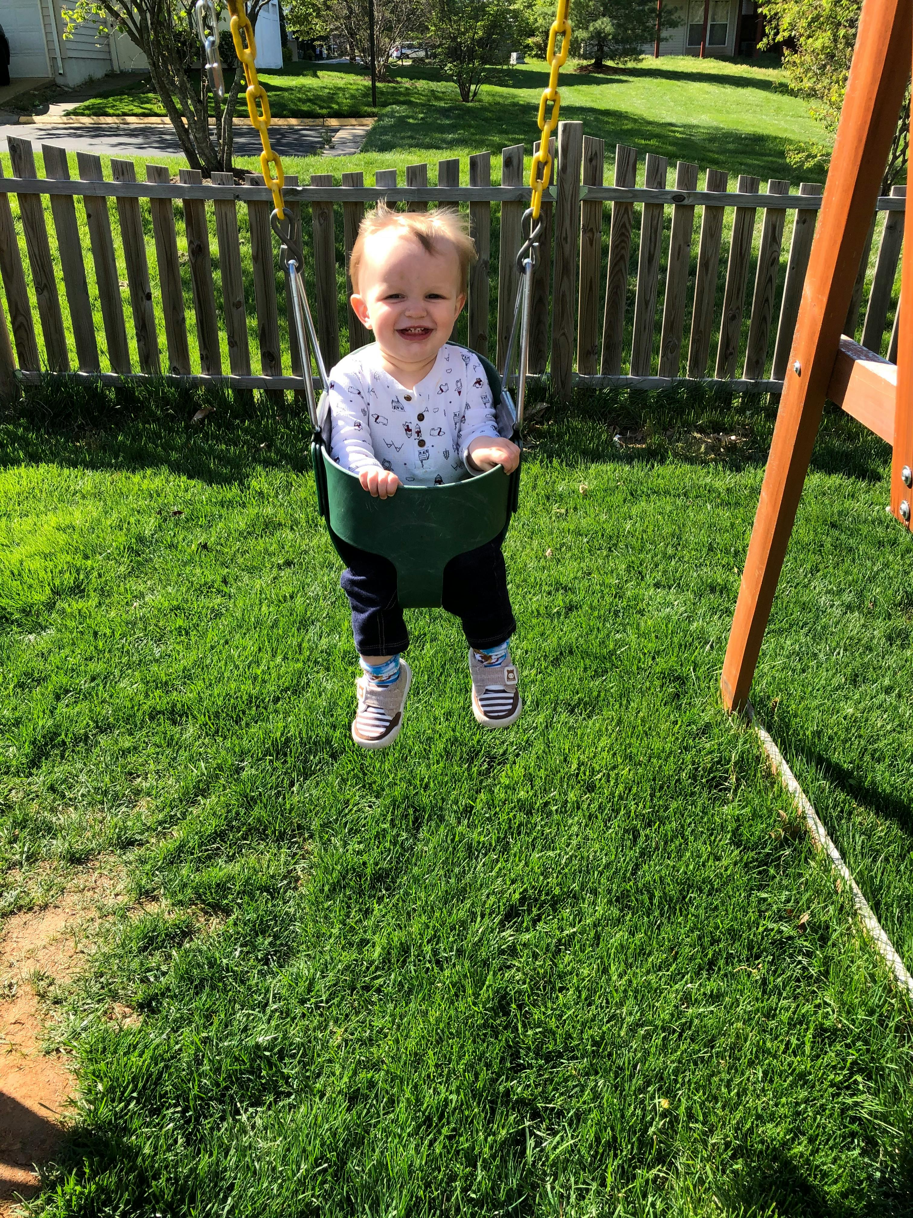 Child in a swing on a playground
