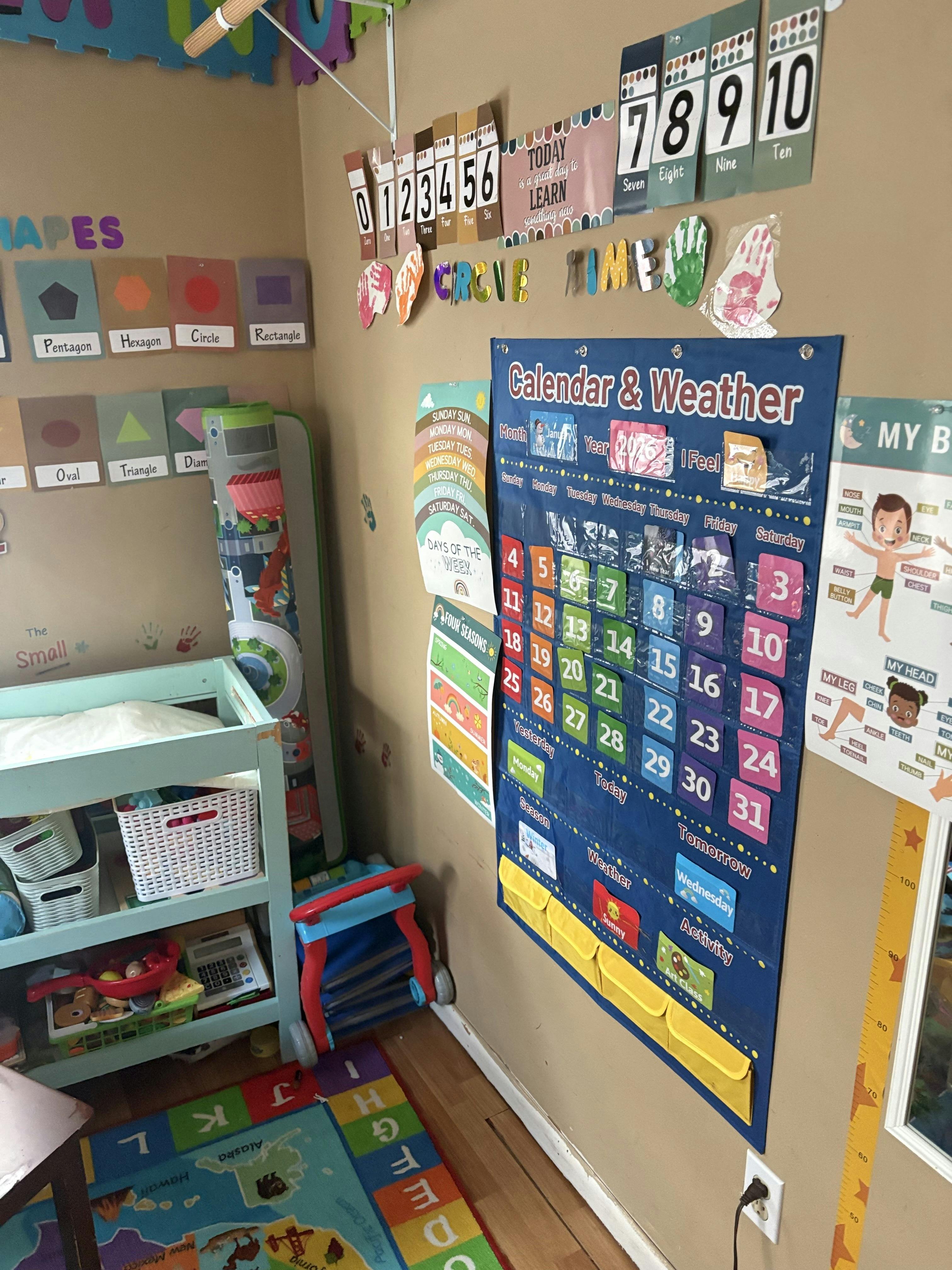 children's educational classroom with a calendar and weather chart, alphabet rug