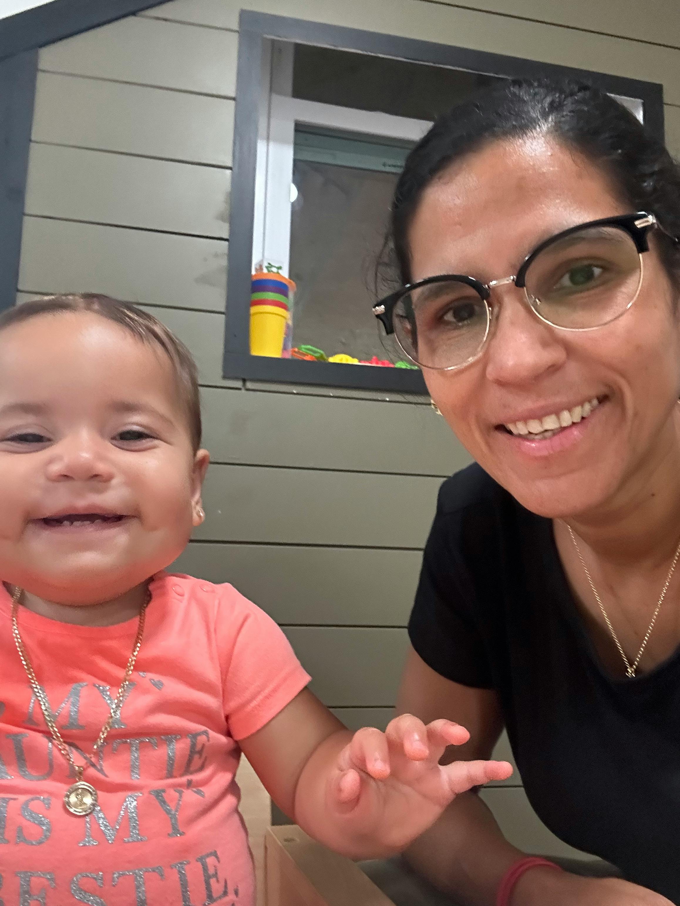 Person in glasses and child smiling