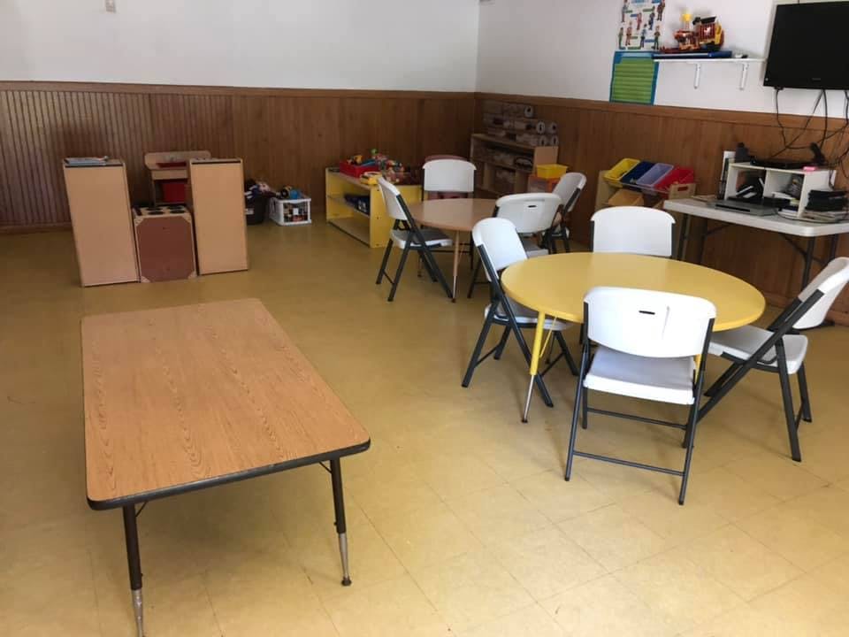 Empty room with several tables and chairs