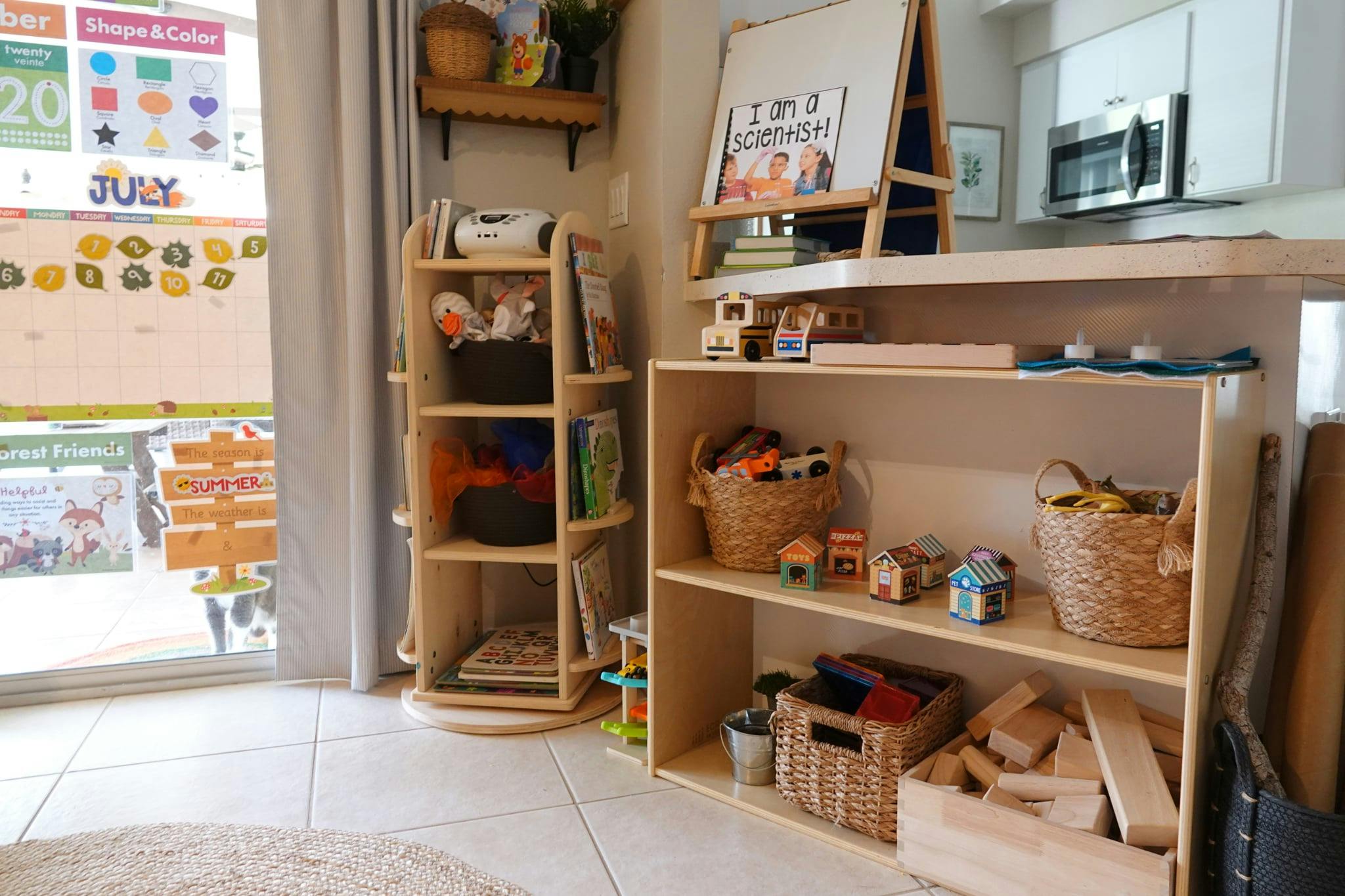 Shelves with toys and baskets in a room with a window