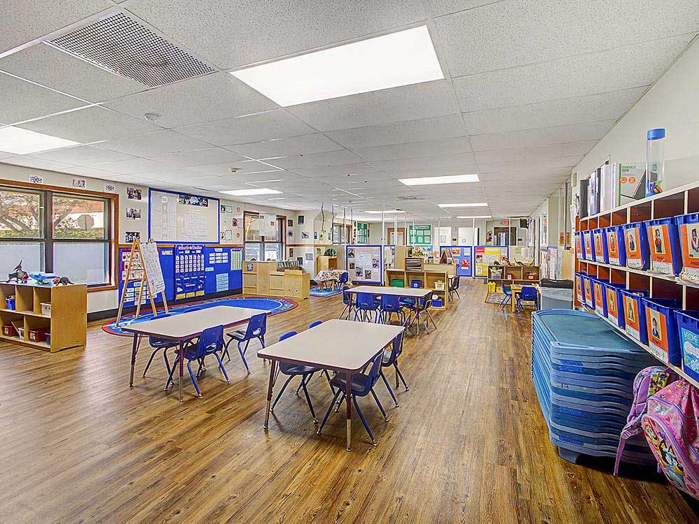 Classroom with tables, chairs, and learning materials