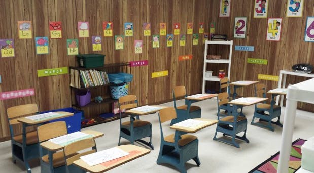 Empty classroom with desks and chairs