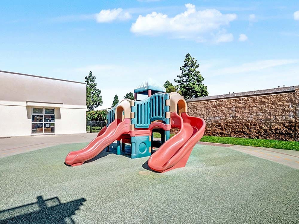 Playground with slides on artificial turf