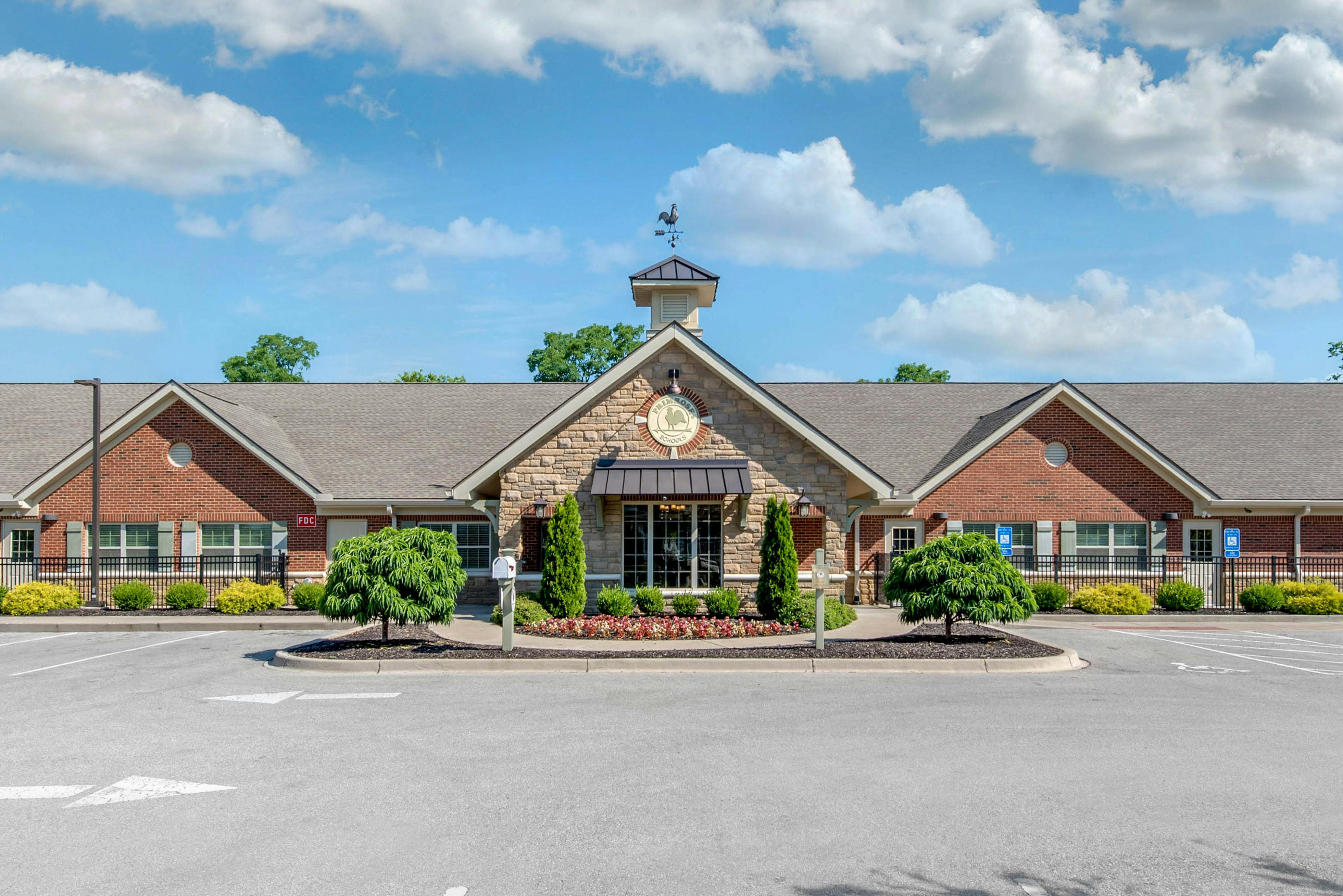 Front exterior of a Primrose Schools building with brick and stone facade