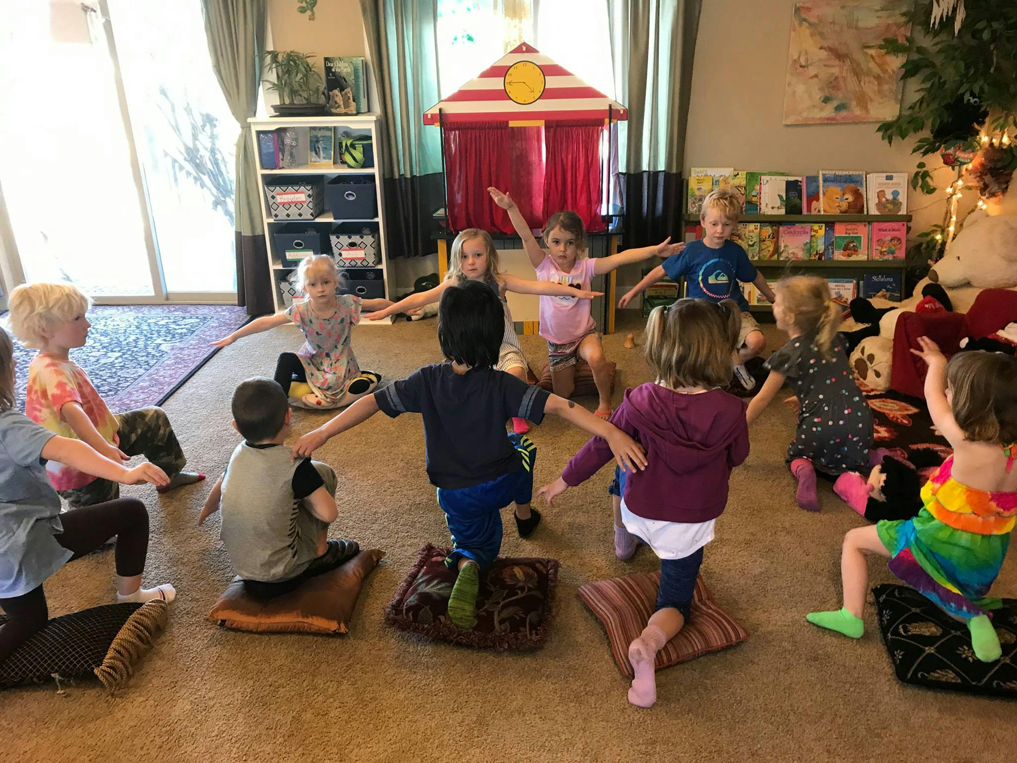 Children in a classroom doing a balancing exercise