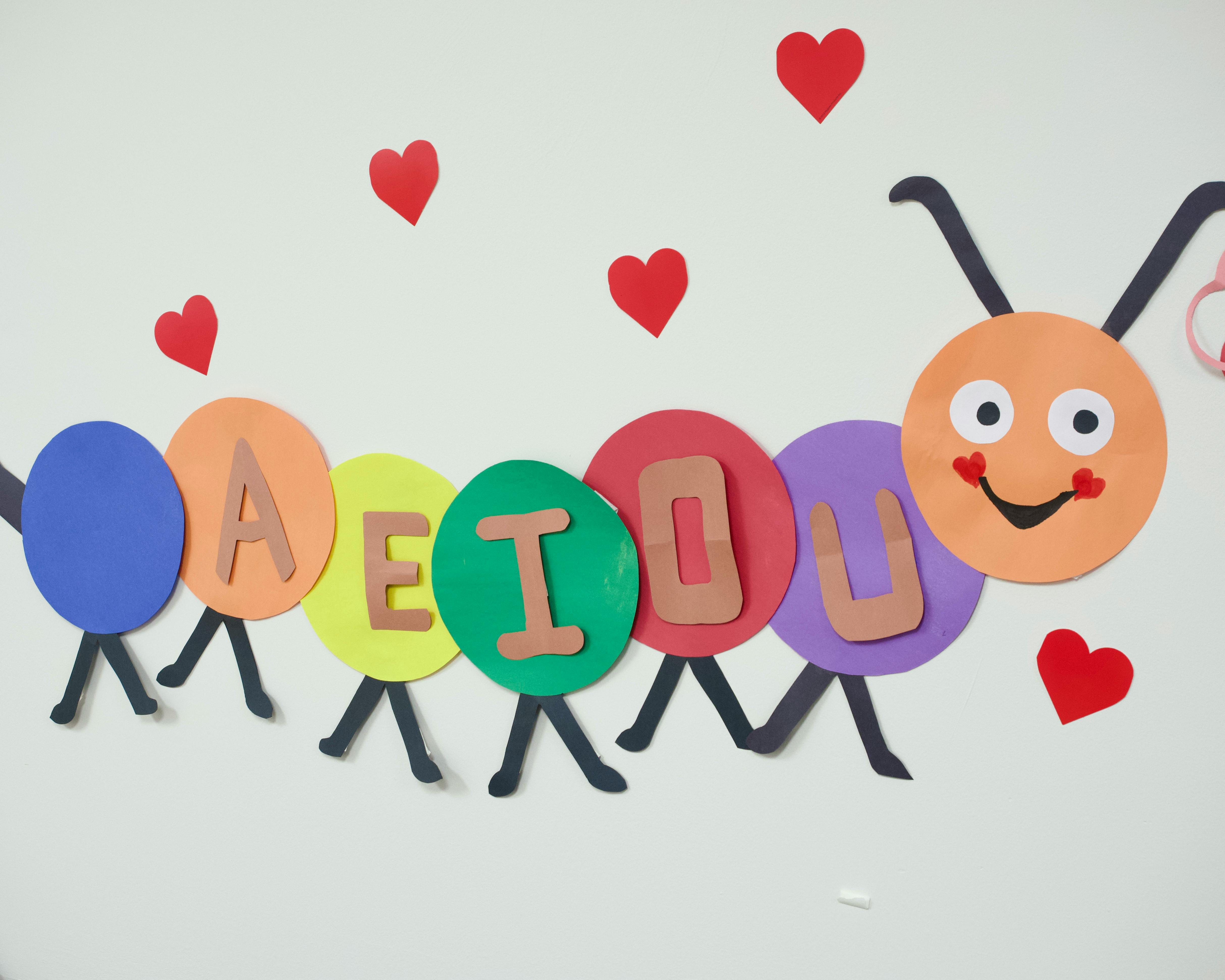Caterpillar craft with letters A, E, I, O, U on its body