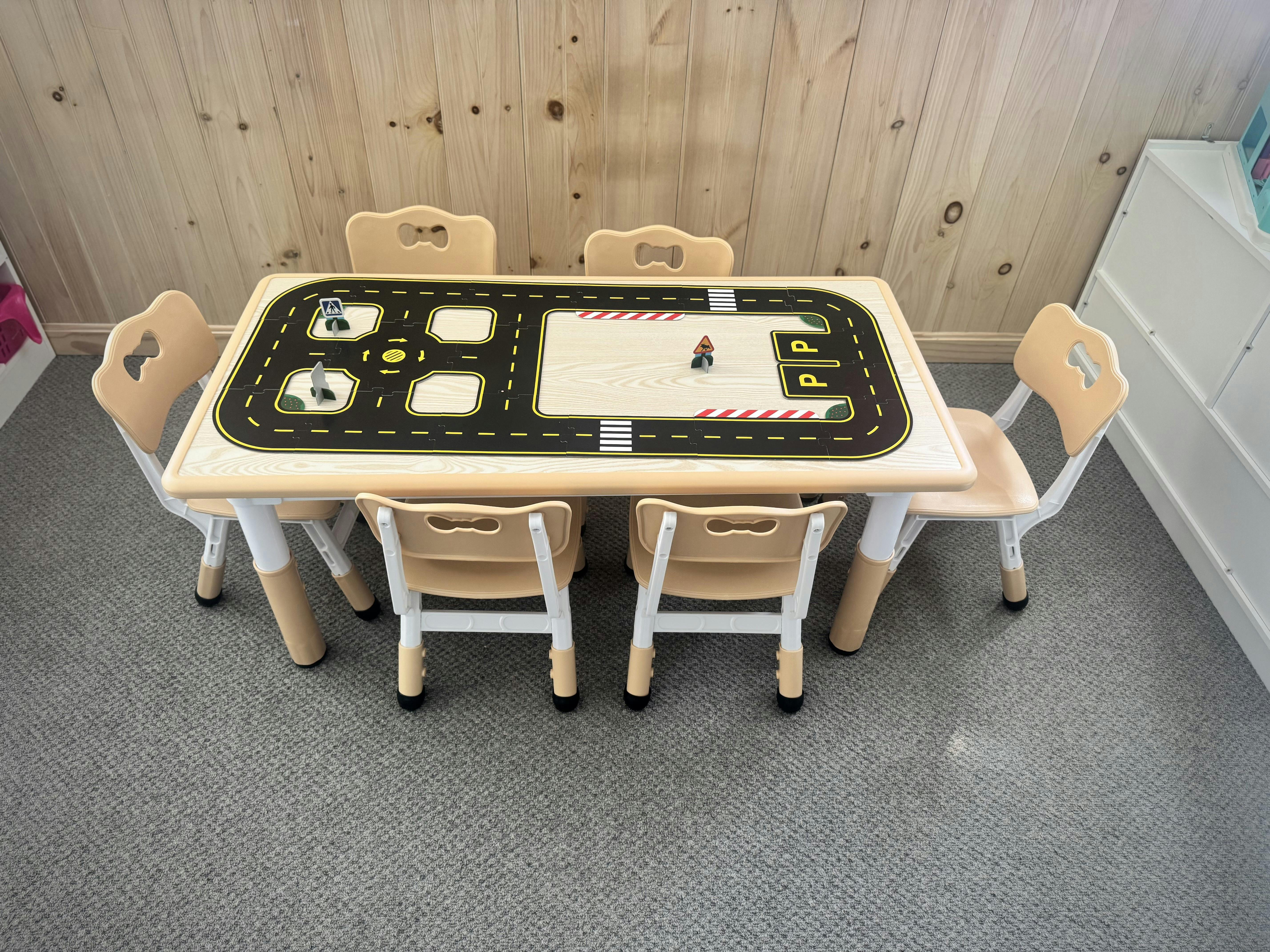 Children's table with a road map design and small chairs