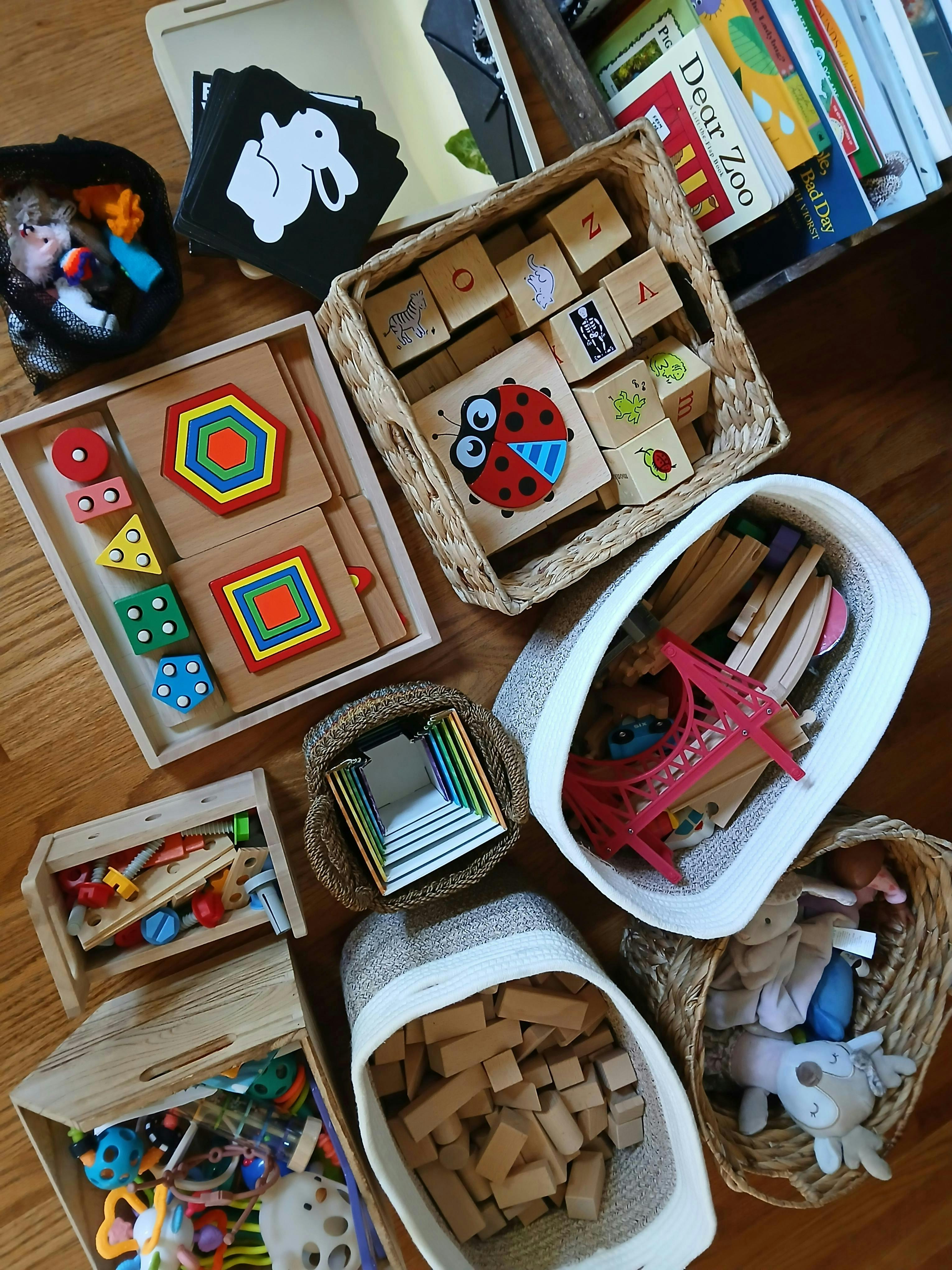 Collection of children's educational toys and books organized in baskets