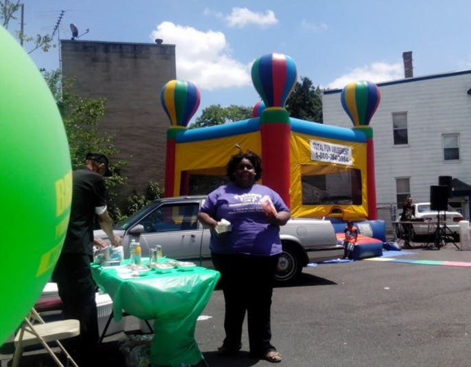 Person standing in front of an inflatable bounce house
